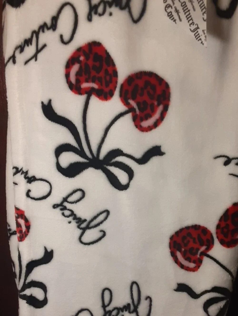 Full Queen Juicy Couture Plush Blanket in White with Red Cherries and Black Bows